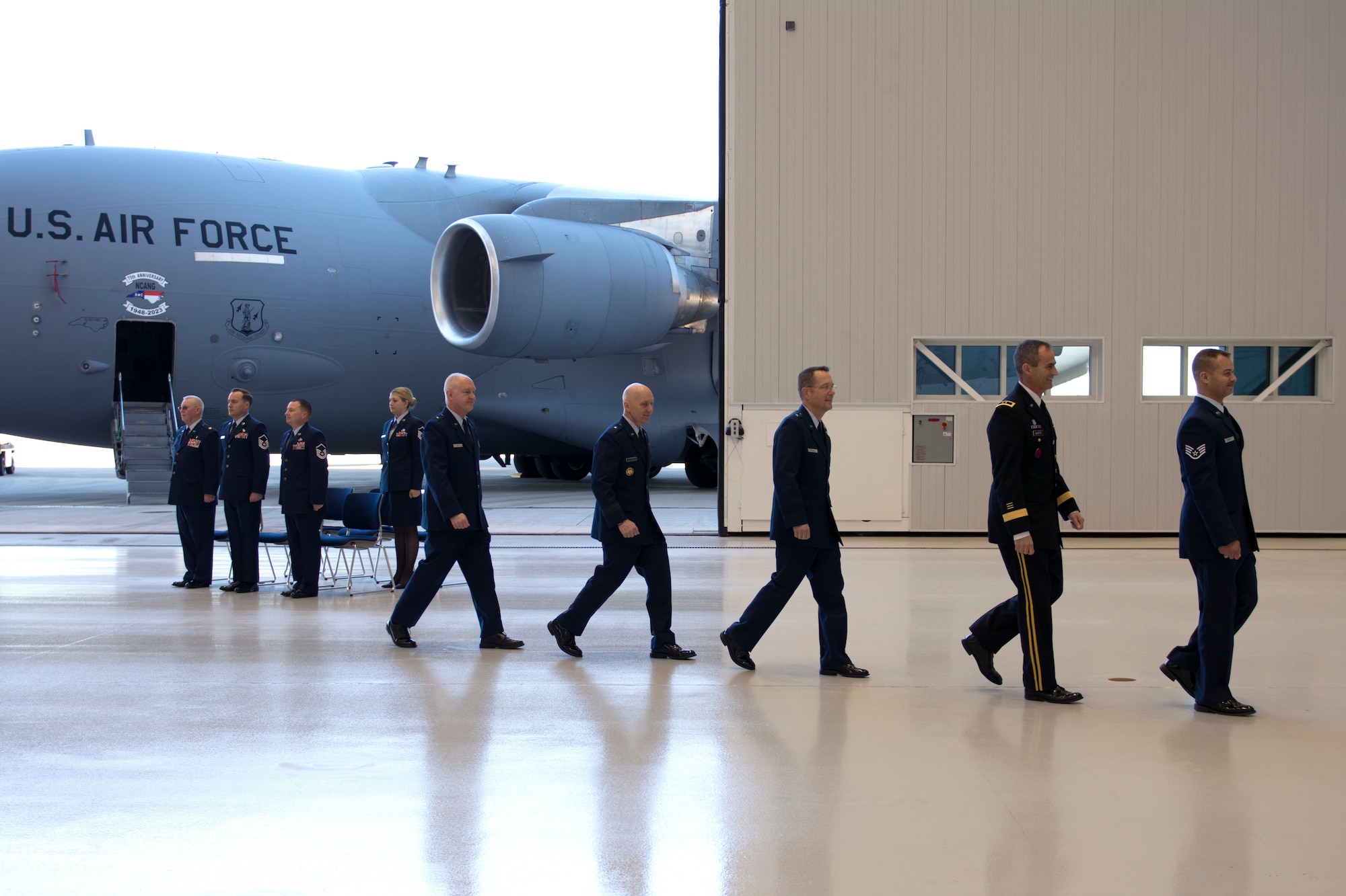 The official party is escorted out upon the conclusion of a ribbon-cutting ceremony held at the North Carolina Air National Guard Base.