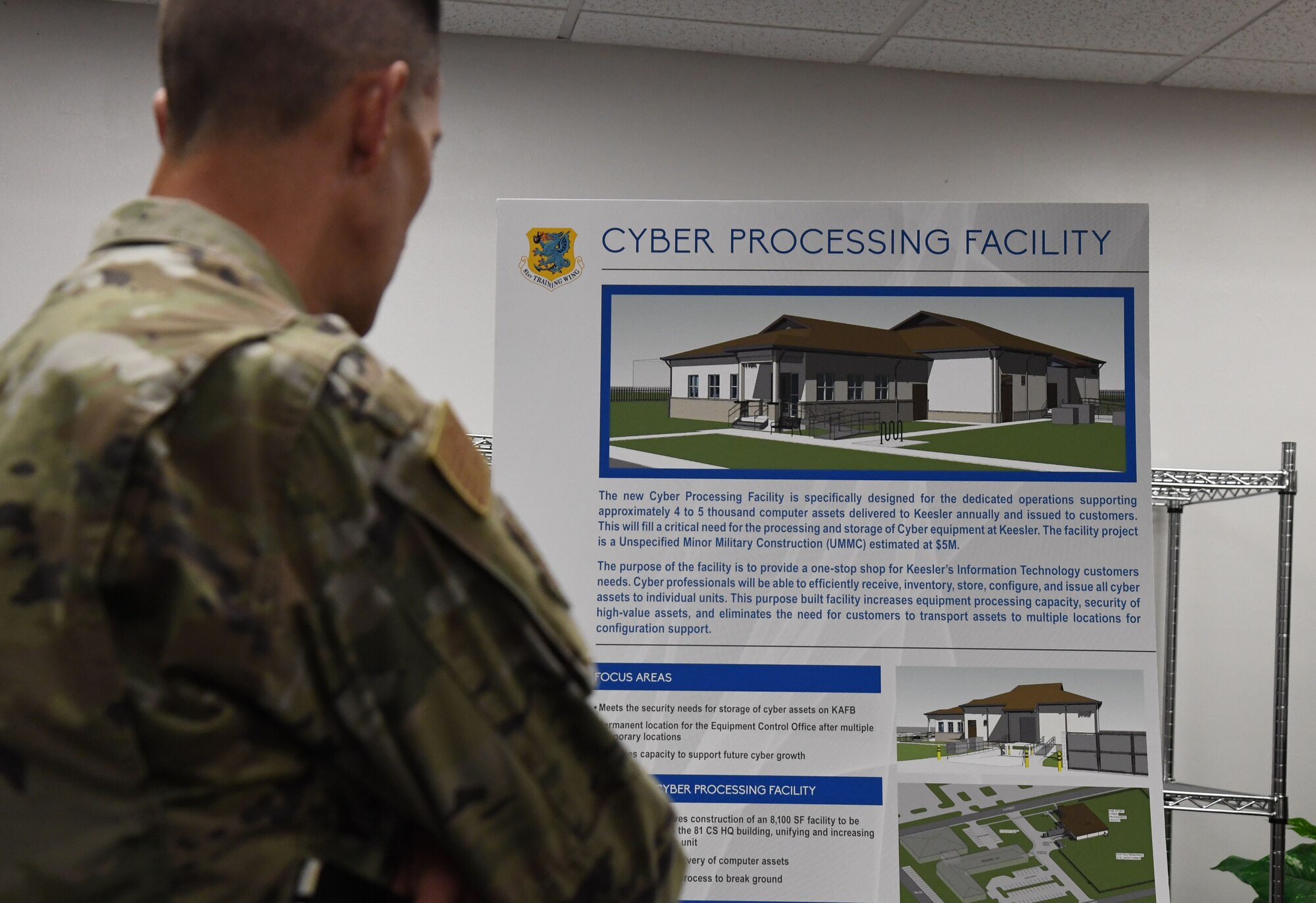 U.S. Air Force Col. Billy Pope, 81st Training Wing commander, views the 81st Communications Squadron's cyber processing facility overview display board during the 81st Mission Support Group Immersion Tour inside the Taylor Logistics Center at Keesler Air Force Base, Mississippi, April 7, 2023.