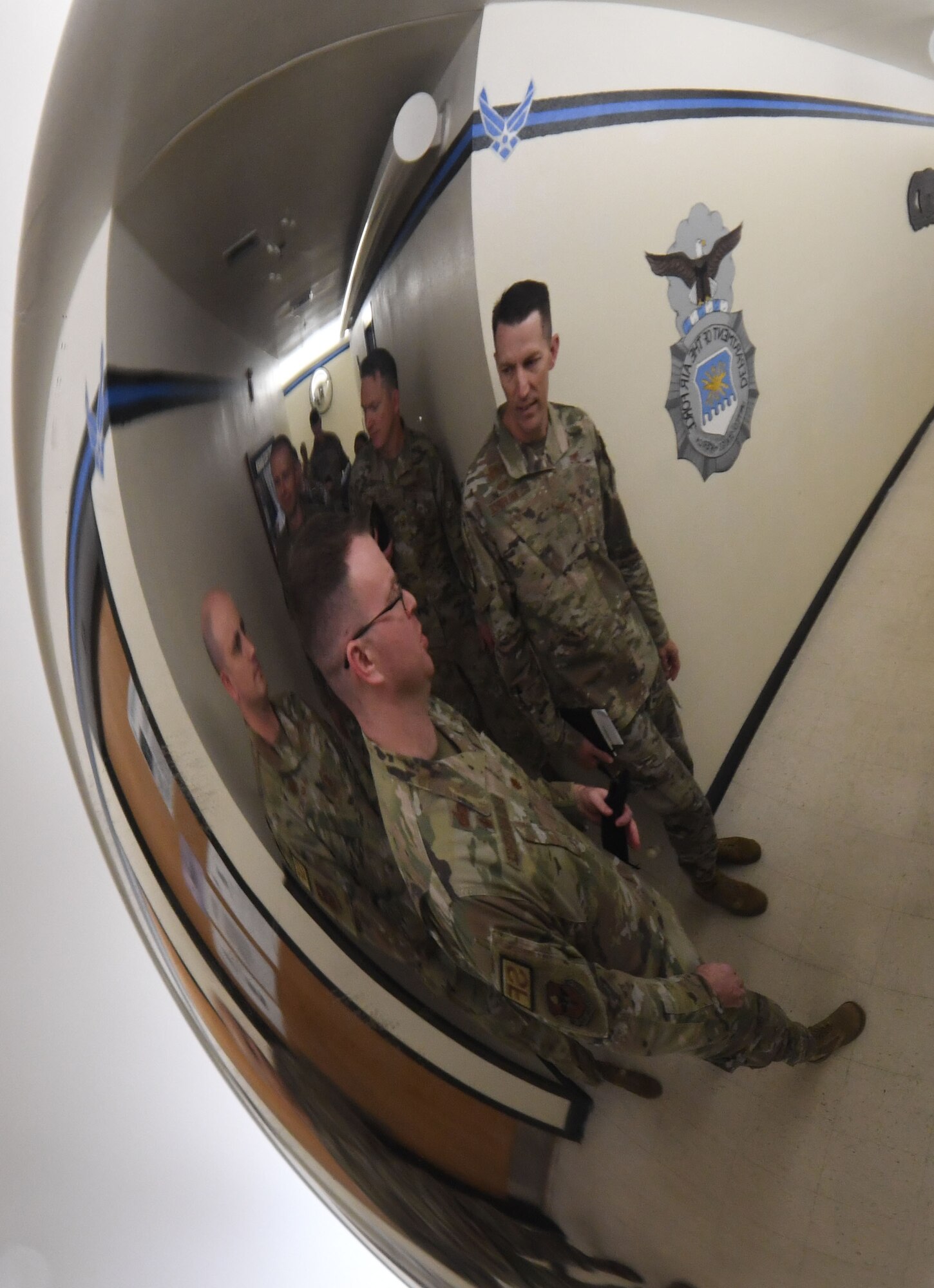 U.S. Air Force Maj. Shaun O'Dell, 81st Security Forces Squadron commander, escorts Col. Billy Pope, 81st Training Wing commander, through the 81st SFS building for an overview of the squadron's mission and capabilities during the 81st Mission Support Group Immersion Tour at Keesler Air Force Base, Mississippi, April 7, 2023.