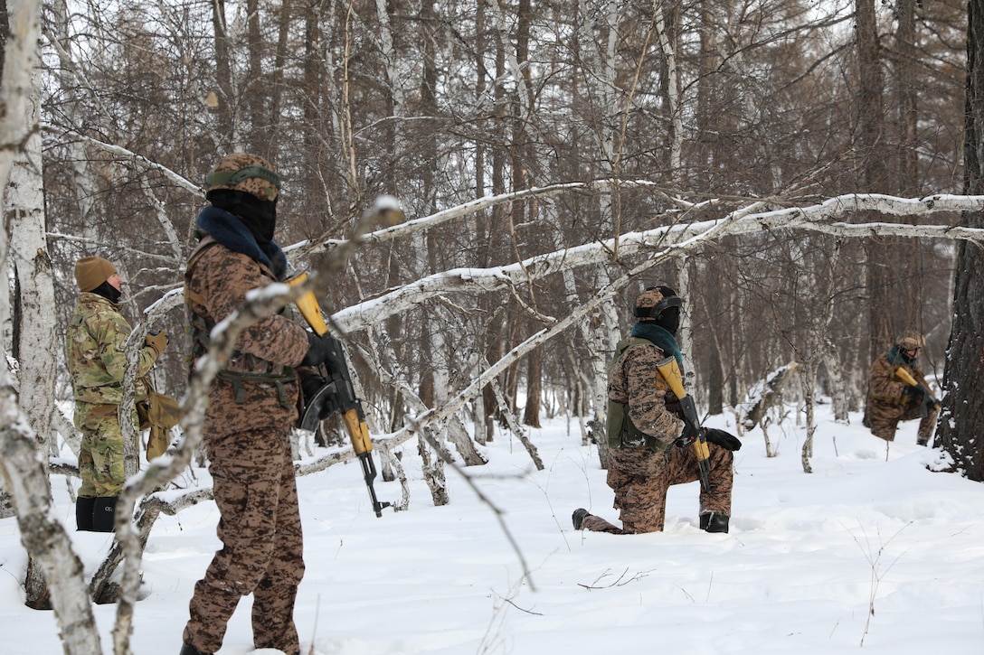 Staff Sgt. Michael Catanzaro, Senior Operations Advisor. Maneuver Advisor Team 5223, 2nd Battalion, 5th Security Force Assistance Brigade advises a Mongolian squad during peacekeeping operations training in a cold weather environment during the Winter of 2022-2023 in Mongolia.