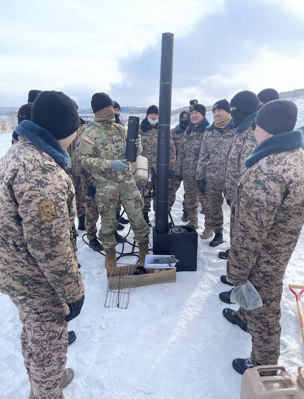 Sgt. 1st Class Frank Lanagan, Company Advisor Team 5220 Mechanic Advisor, leads the U.S. portion of a training discussion on squad equipment for cold weather survivability in Mongolia, Winter 2022-2023.