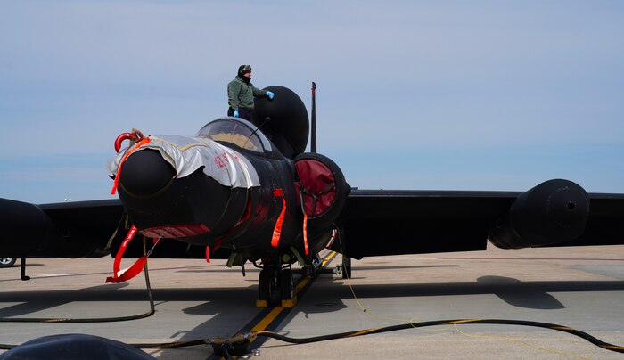 A U.S. Air Force 9th Aircraft Maintenance Squadron crew chief assesses a U-2 Dragon Lady after fueling during Dragon Flag EAST, March 29, 2023, at Offutt Air Force Base, Nebraska.