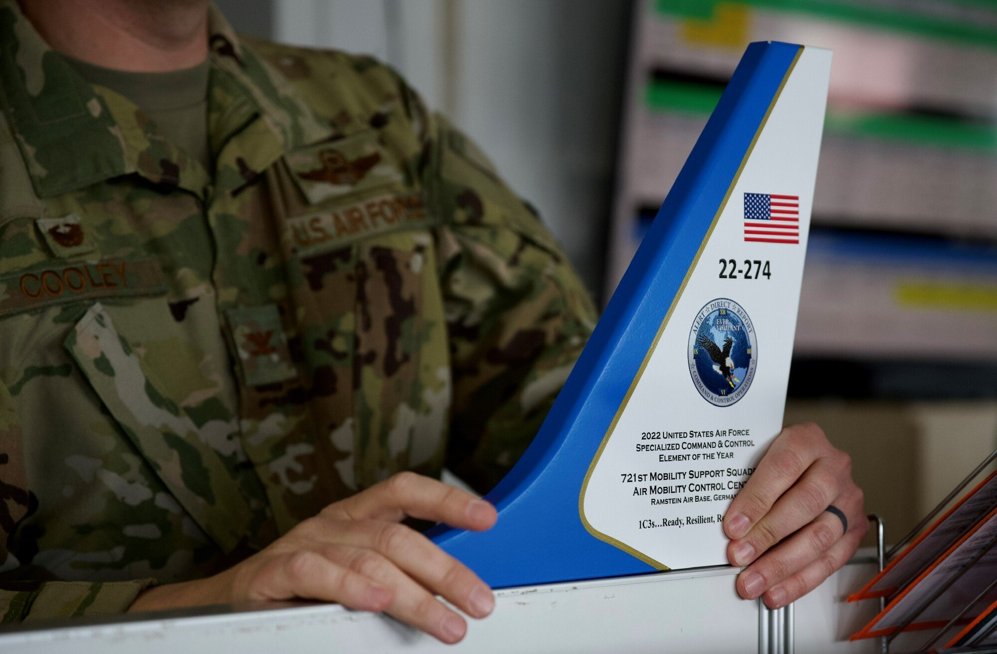 Col. Dan Cooley, 521st Air Mobility Operations Wing commander, presents the 2022 U.S. Air Force Air Mobility Control Center of the Year Award on Ramstein Air Base, Germany, March 20, 2023.
