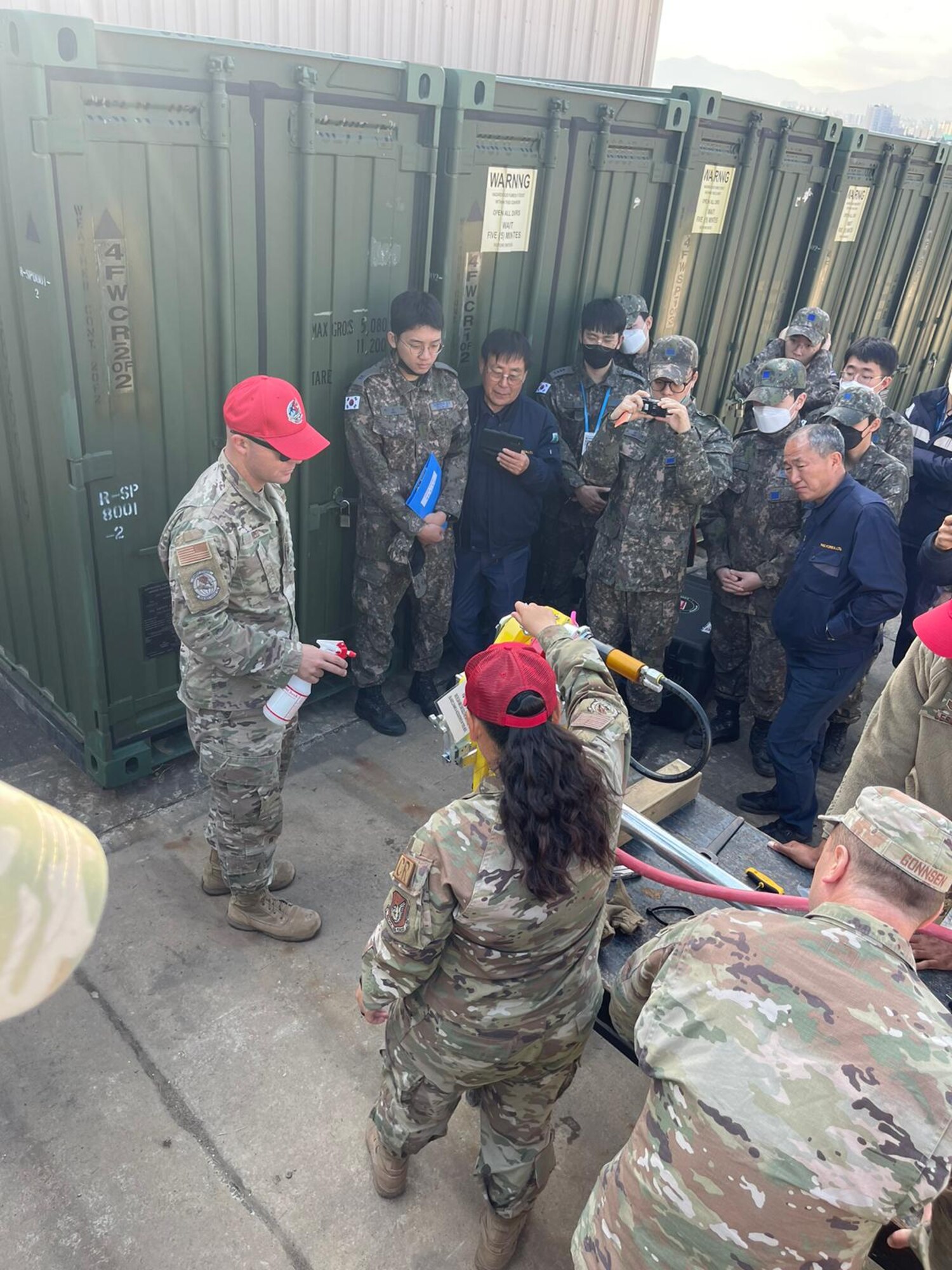 U.S. Air Force Tech. Sgt. Travis Reed, 554th Rapid Engineer Deployable Heavy Operational Repair Squadron Engineer silver flag instructor, and Tech. Sgt. Thao Chau, 554th Rapid Engineer Deployable Heavy Operational Repair Squadron Engineer silver flag instructor, demonstrate how to use a guillotine saw during a training course at Daegu Air Base, Republic of Korea, March 13-16, 2023.