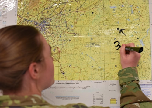 U.S. Air Force Airman Madelyn Barber, 315th Training Squadron student, writes coordinates at Goodfellow Air Force Base, Texas, April 7, 2023. Students learn to rely on each other during the course for different perspectives and approaches to achieve solutions. (U.S. Air Force photo by Senior Airman Sarah Williams)