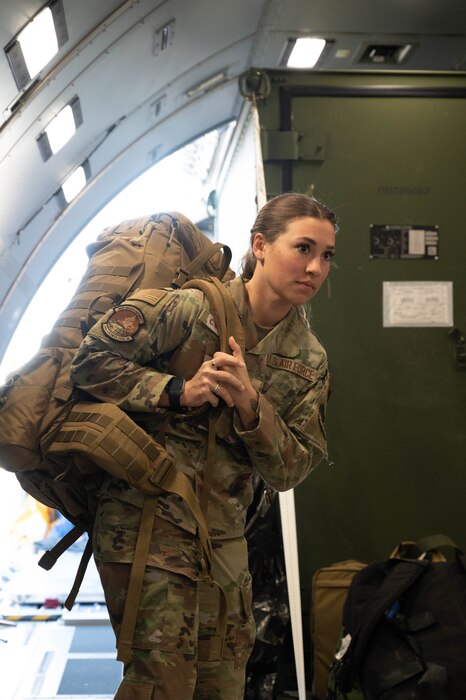 Airman 1st Class Amelia Gapp, a 934th Aeromedical Evacuation Squadron technician, loads bags onto an aircraft at the Minneapollis-St. Paul Air Reserve Station, Minnesota, March 27, 2023. Gapp went with other squadron members on a three-day exercise to the Virgin Islands. (U.S. Air Force photo by Senior Airman Victoriya Tarakanova)