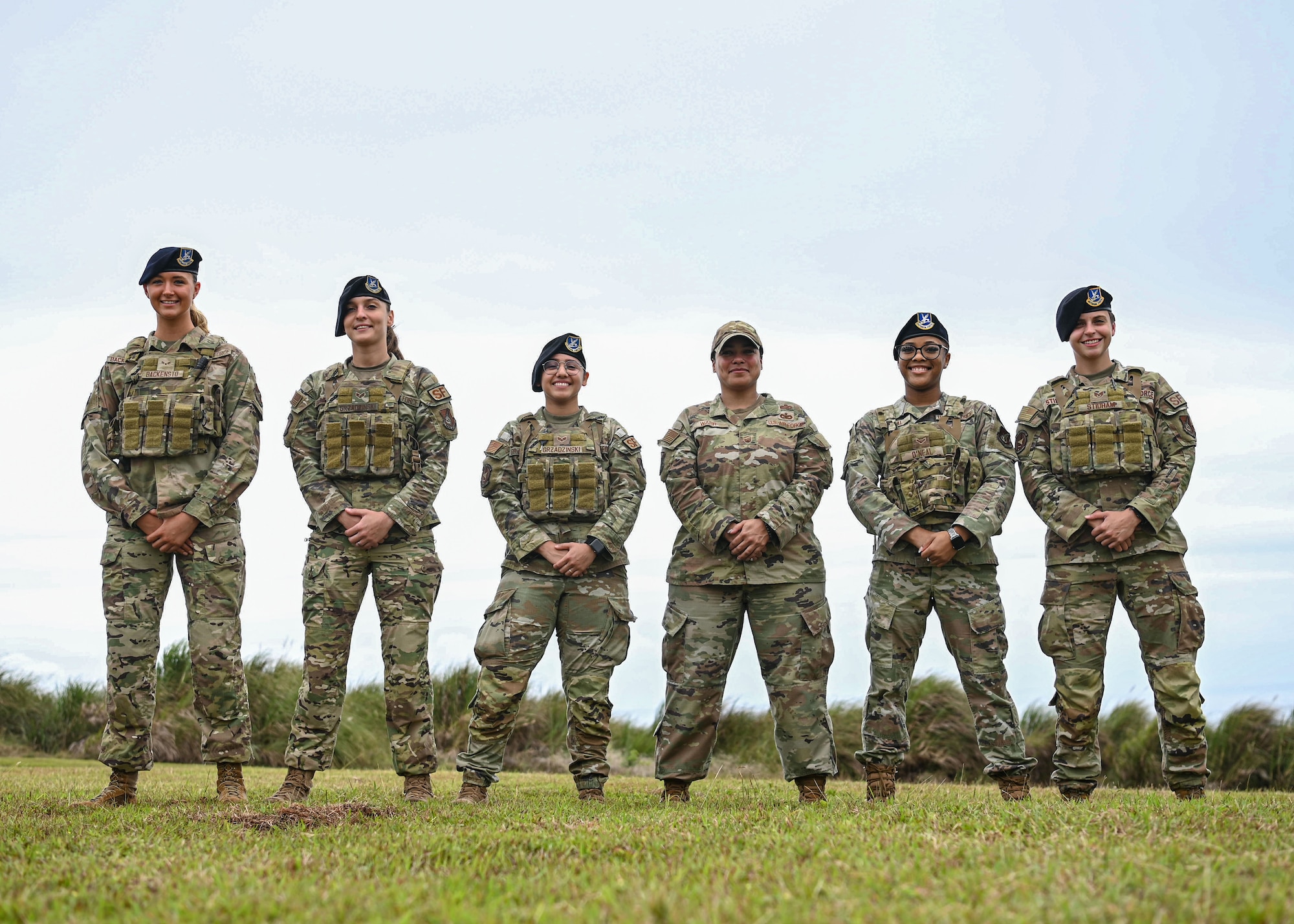 Female defenders from the 36th Security Forces Squadron stand united with Senior Master Sgt. Jeanette Warr, the 36th Wing Equal Opportunity director and prior defender, at Andersen Air Force Base, Guam, April 6, 2023. Although Warr is not in the daily grind with defenders anymore, as an EO director Warr is able to embed during commander calls, host trainings and teach squadron positive communication techniques while building trust with one another, and most importantly be known on the base so she can help those who need it. (U.S. Air Force photo by Staff Sgt. Aubree Owens)