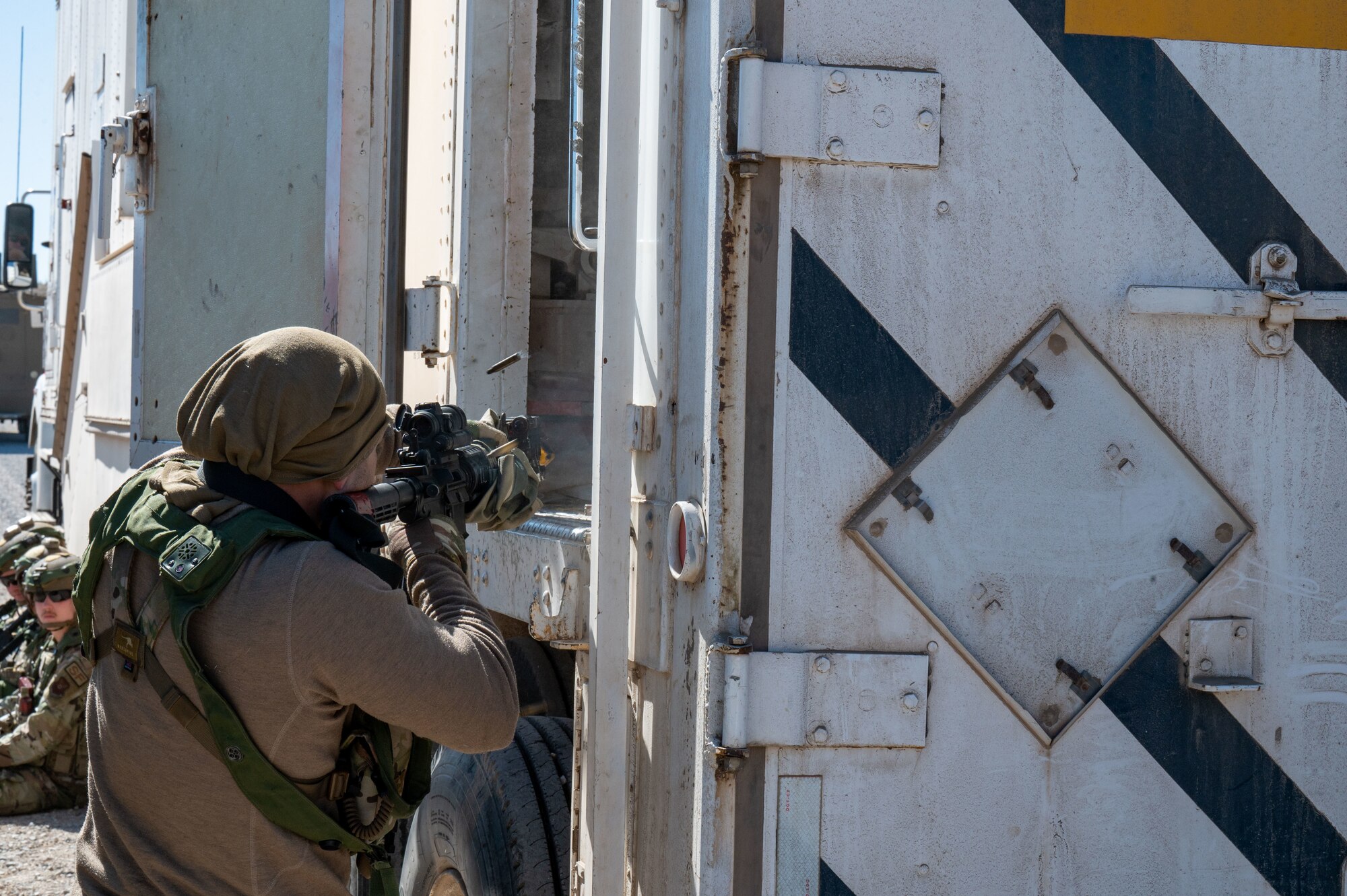 opposing force member attempts ingress into a convoy vehicle