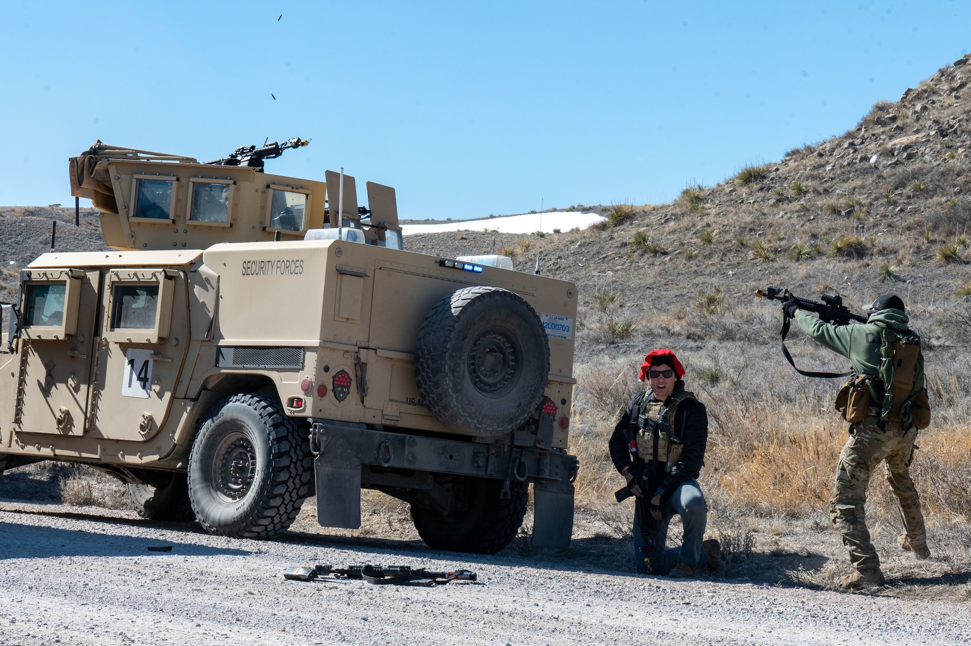 opposing force members move on a convoy