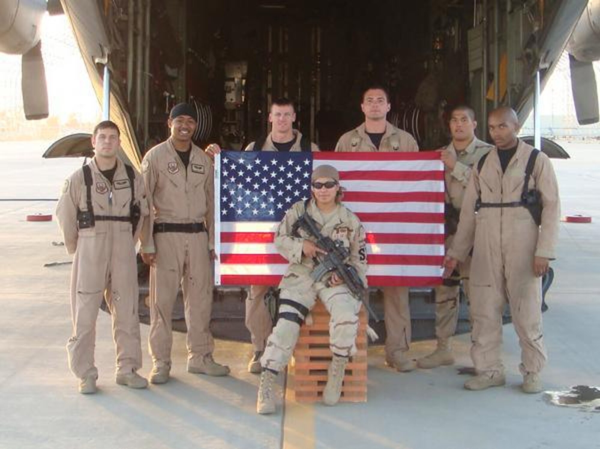 Senior Airman Jeannette Warr, a security forces defender deployed to Iraq from the 55th Security Forces Squadron, Offutt Air Force Base, Neb., takes a group photo with fellow members of the Fly Away Security Team in 2007. Warr decided early in her career that she wanted to be one of the few female defenders that made it to the top ranks to inspire change in her career field. (Courtesy Photo)