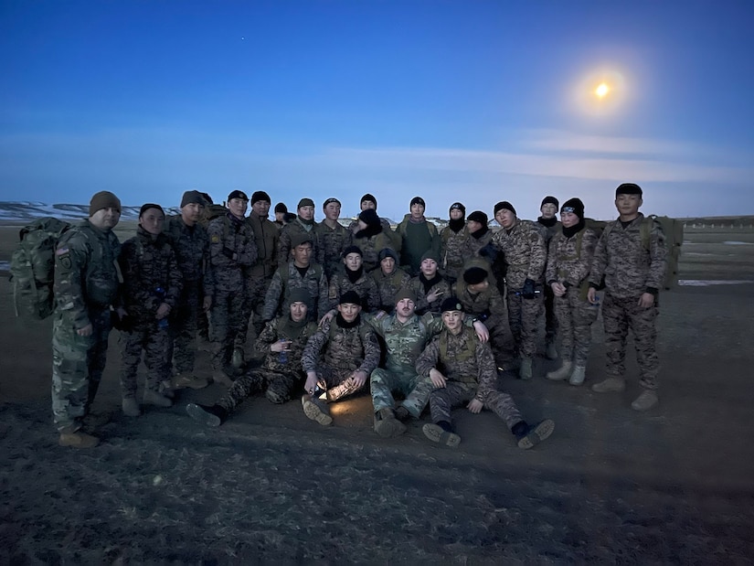 Advisors from 5th SFAB pose with Mongolian students during the Junior Sergeant Course held in Mongolia, Winter 2022-2023. SFAB Advisors partnered with and mentored Mongolian students during this NCO education course during their six months they were employed in Mongolia.