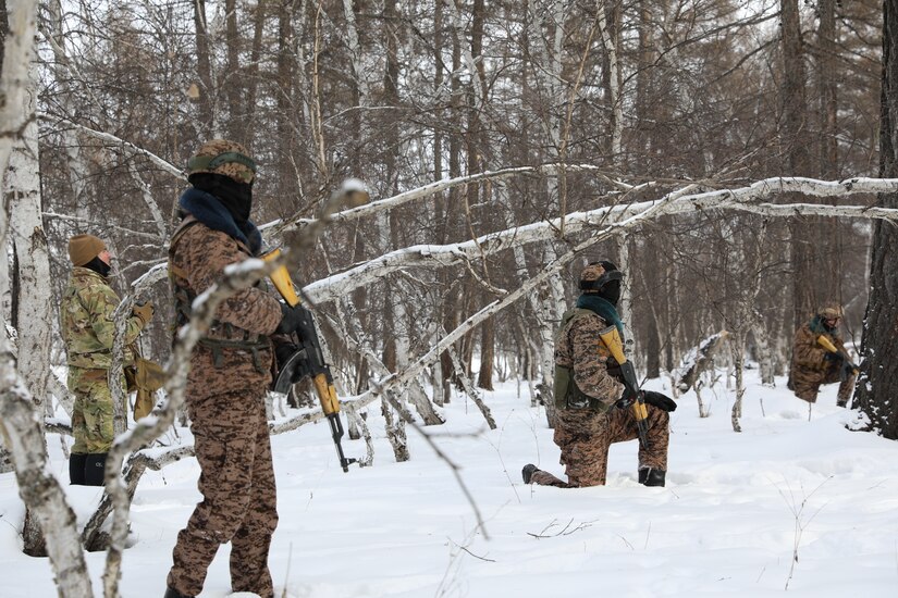 Staff Sgt. Michael Catanzaro, Senior Operations Advisor. Maneuver Advisor Team 5223, 2nd Battalion, 5th Security Force Assistance Brigade advises a Mongolian squad during peacekeeping operations training in a cold weather environment during the Winter of 2022-2023 in Mongolia.