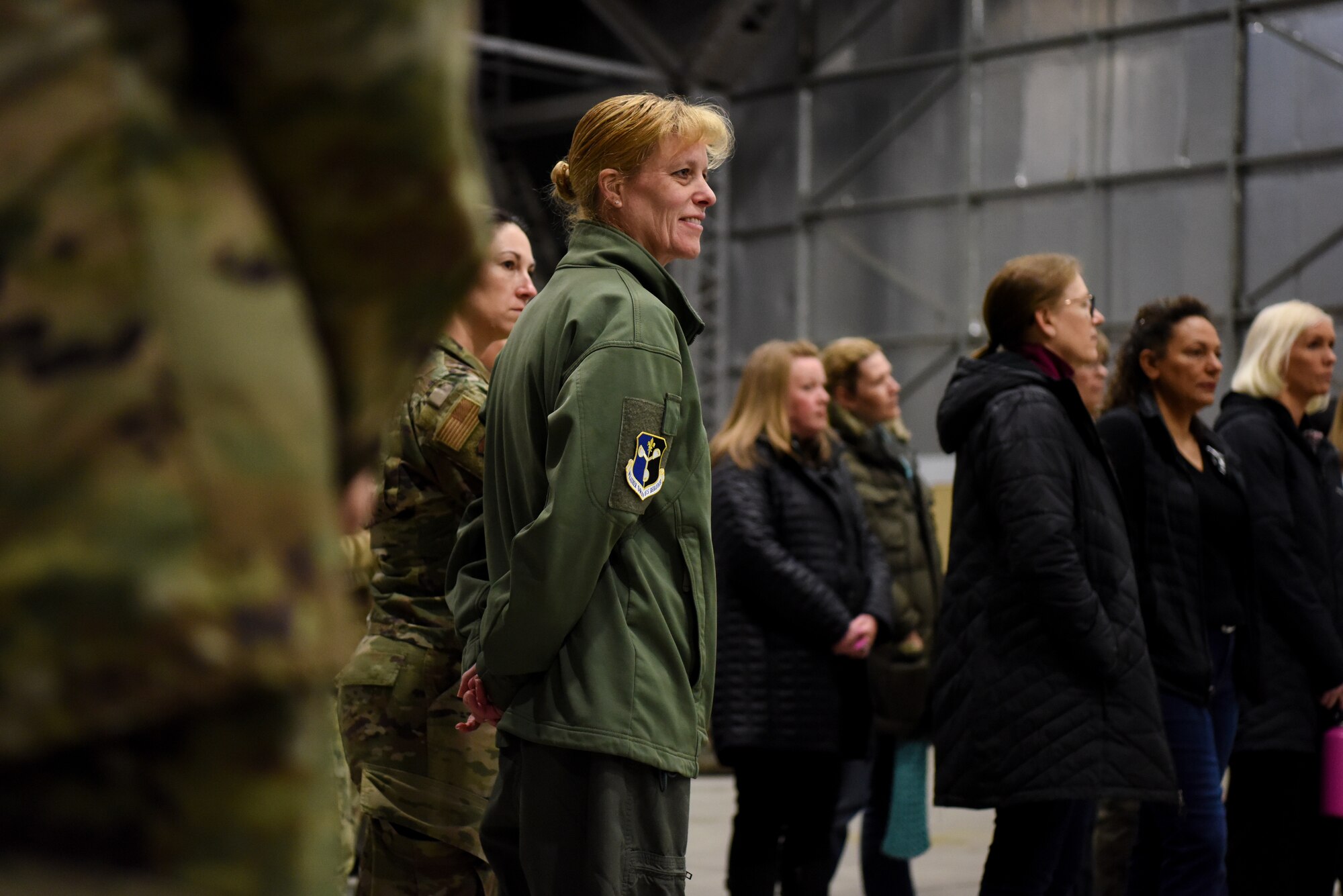 U.S. Air Force Col. Kristen Thompson, 55th Wing Commander, listens with 55th Wing key spouses to a U-2 Dragon Lady capabilities brief from a 9th Reconnaissance Wing pilot March 29, 2023, at Offutt AFB, Nebraska.
