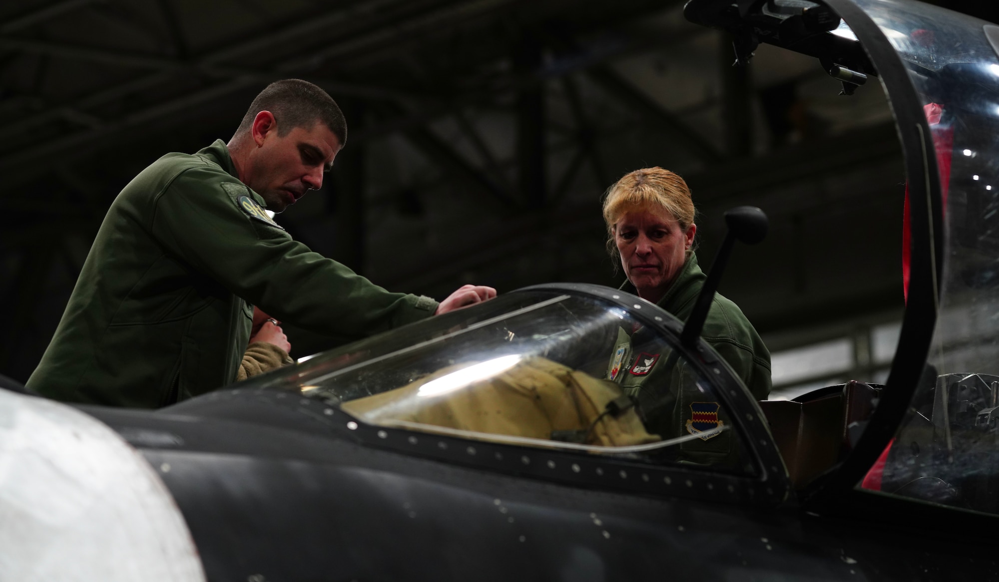 U.S. Air Force Col. Kristen D. Thompson, 55th Wing commander, learns about the cockpit area and capabilities of the U-2 Dragon Lady from a 99th Reconnaissance Squadron U-2 pilot March 29, 2023, at Offutt Air Force Base, Nebraska.