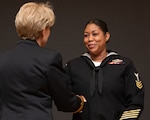 230406-N-DQ752-0015 SAN ANTONIO, Texas (Apr. 6, 2023) Hospital Corpsman 1st Class Aisha R. Thomas, Naval Medical Leader and Professional Development Command, shakes the hand of Rear Adm. Cynthia A. Kuehner, commander of Naval Medical Forces Support Command (NMFSC) after being selected as the NMFSC 2023 Sailor of the Year on April 6. (U.S. Navy Photo by Mass Communication Specialist 2nd Class Cheyenne Geletka)