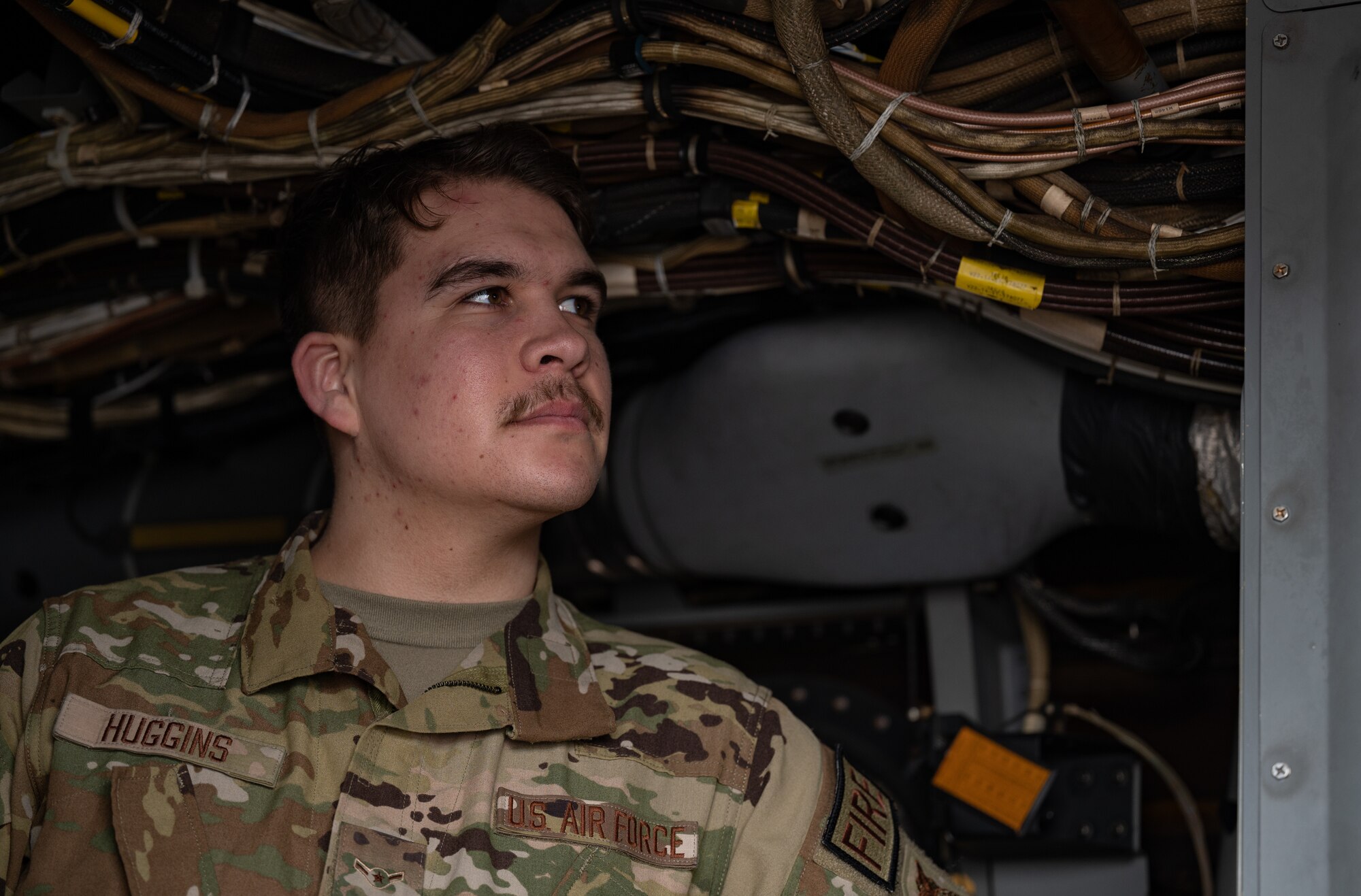 U.S. Air Force Airman Noah Huggins, 100th Civil Engineer Squadron firefighter, listens to a brief about 352nd Special Operations Wing CV-22B Osprey aircraft engine shutdown procedure, March 31, 2023, at Royal Air Force Mildenhall, England.