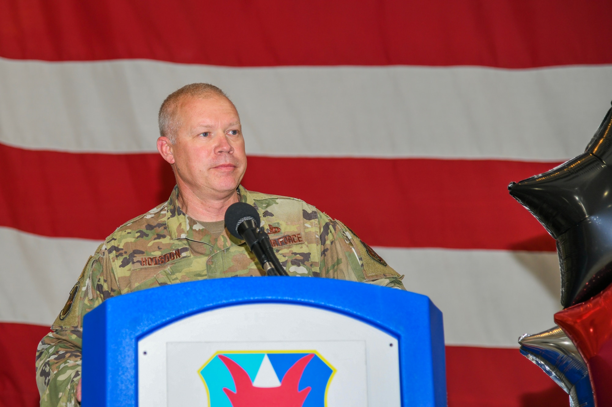 A photo of Senior Master Sgt. Michael J. Hodsdon, 177th Aircraft Maintenance Squadron senior enlisted leader, speaks at a podium.