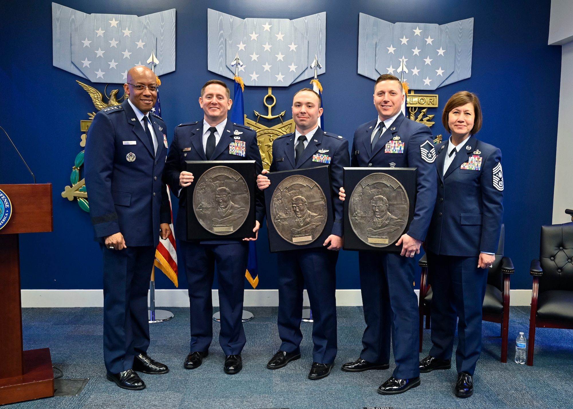 Air Force Chief of Staff Gen. CQ Brown, Jr. and Chief Master Sgt. of the Air Force JoAnne S. Bass pose with Col. Carl Miller, second from left, Lt. Col. Justin Burrier and Master Sgt. Jeffrey Fitzgerald, recipients of the 2019 Lance P. Sijan USAF Leadership Awards, during a ceremony at the Pentagon, Arlington, Va., April 3, 2023. The award is named for Medal of Honor recipient Capt. Lance Sijan, who died while being held as a prisoner of war during the Vietnam War. (U.S. Air Force photo by Eric Dietrich)