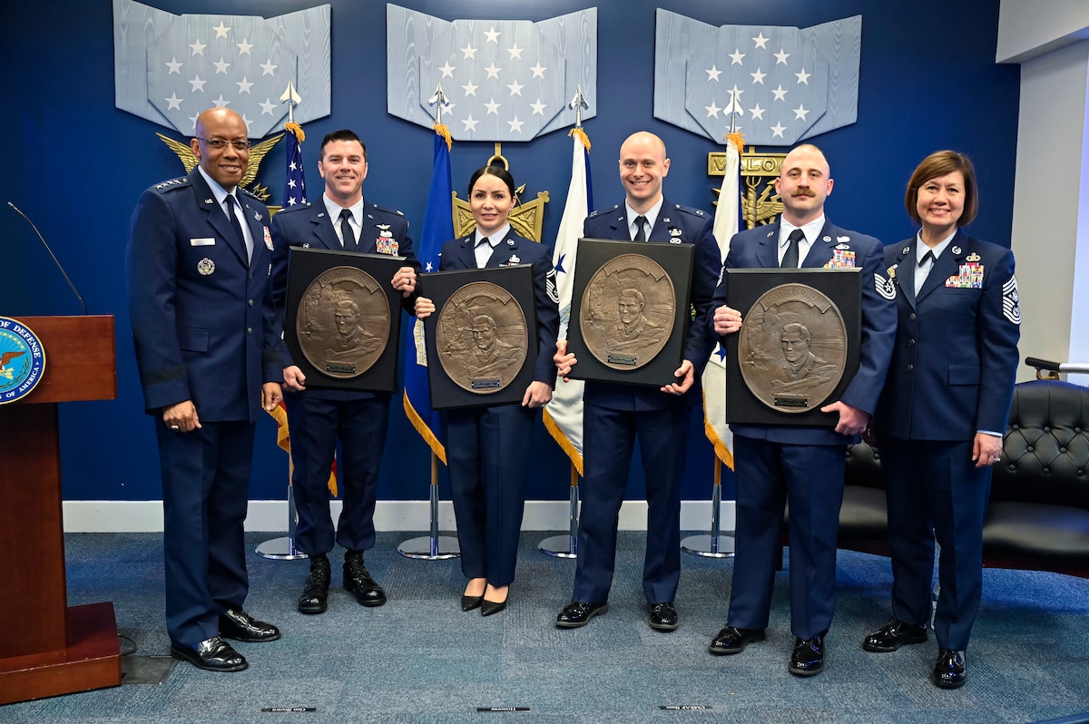 Air Force Chief of Staff Gen. CQ Brown, Jr. and Chief Master Sgt. of the Air Force JoAnne S. Bass pose with Lt. Col. Morgan Laird, second from left, Senior Master Sgt. Karla Pelayo, Capt. Christopher Locke and Tech. Sgt. Connor Hamilton, recipients of the 2022 Lance P. Sijan USAF Leadership Awards, during a ceremony at the Pentagon, Arlington, Va., April 3, 2023. The award is named for Medal of Honor recipient Capt. Lance Sijan, who died while being held as a prisoner of war during the Vietnam War. (U.S. Air Force photo by Eric Dietrich))