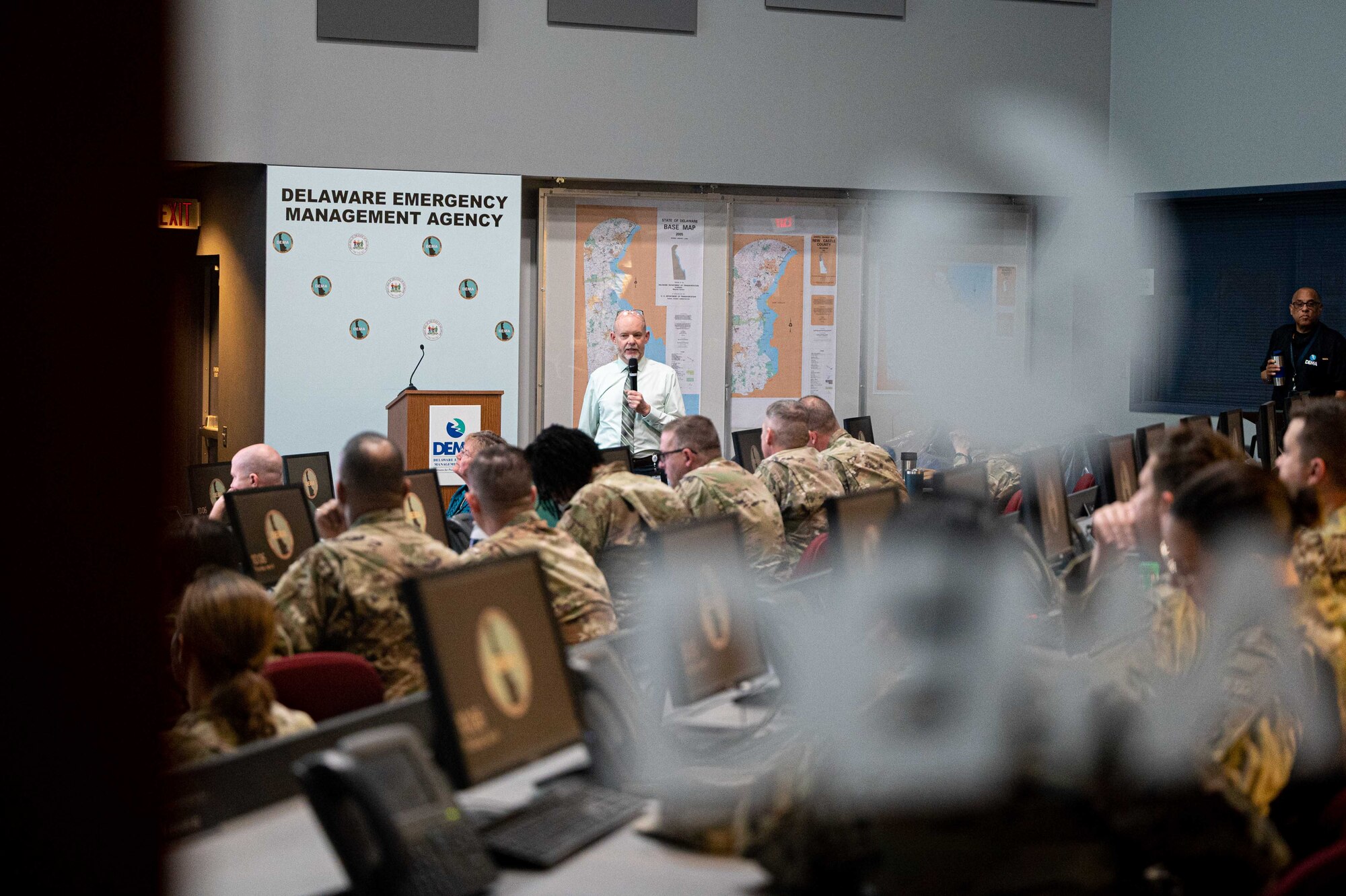 Chris Murtha, Delaware Emergency Management Agency deputy director, briefs representatives from the 436th Mission Support Group and the 512th MSG during an immersion event in Smyrna, Delaware, April 6, 2023. During the event, DEMA was able to share best practices with Team Dover Airmen regarding preparedness for natural disasters, terrorism response, emergency operations center training, behavior threat analysis for school safety and community engagement. (U.S. Air Force photo by Senior Airman Faith Barron)