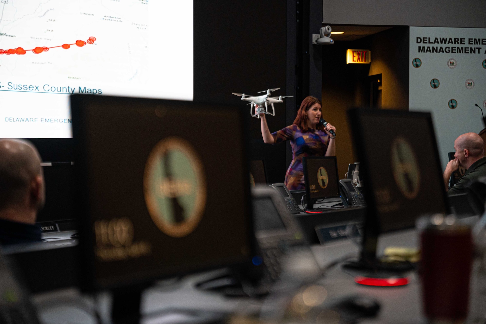 Paige Fitzgerald, Delaware Emergency Management Agency deputy director, briefs representatives from the 436th Mission Support Group and the 512th MSG on drone operations during an immersion event in Smyrna, Delaware, April 6, 2023. During the event, DEMA was able to share best practices with Team Dover Airmen regarding preparedness for natural disasters, terrorism response, emergency operations center training, behavior threat analysis for school safety and community engagement. (U.S. Air Force photo by Senior Airman Faith Barron)