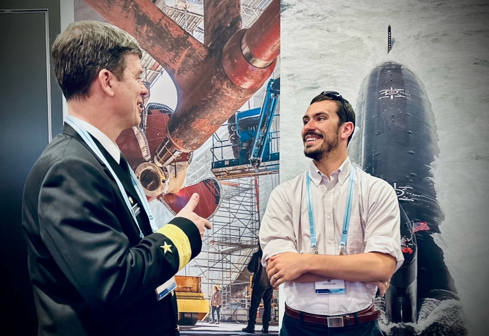 Rear Adm. Kevin Byrne, Commander, Naval Sea Systems Command (NAVSEA) Warfare Centers talks with Dr. Lee Huntington, engineer, Naval Surface Warfare Center Carderock Division, at the NAVSEA booth during Sea-Air-Space Exposition 2023 at the Gaylord Convention Center in National Harbor, Md., on April 4. (U.S. Navy photo by Monica McCoy)