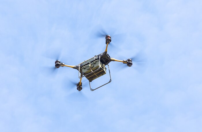The Tactical Resupply Unmanned Aircraft Systemflies during a demonstration at DZ Cockatoo on Marine Corps Base Quantico, Virginia, March 29, 2023. Combat Development and Integration demonstrated the TRUAS, programming the Unmanned Logistics Systems-Air to carry a payload over a short distance, drop it at a specified location in the landing zone and return to its staring point. The TRUAS has a 9-mile range and maximum payload of 150 pounds, which is sufficient to fly in ammunition, food, medical supplies, and batteries, among other supplies. This small system only requires two Marines to operate and will be a game-changing capability for our distributed forces. Fielding this capability is a critical step in setting conditions for the development of the ULS-A Medium system, which is the required capability for large-scale tactical distribution in a contested space.