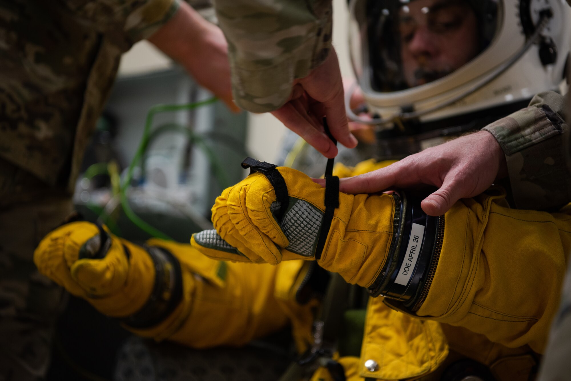 U.S. Air Force 9th Physiological Support Squadron Airmen secure a 99th Reconnaissance Squadron U-2 Dragon Lady pilot’s gloves and suit for a high flight April 1, 2023, at Offutt Air Force Base, Nebraska.