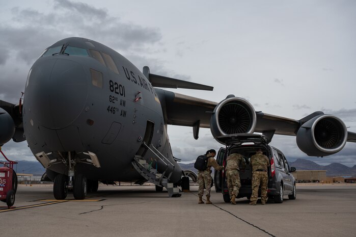 United States Air Force and Army service members disassemble the Command and Control Element after Black Flag 23-1 at Nellis Air Force Base, Nevada, Feb. 23, 2023. This allowed for Air Force Command and Control to access real time data and resources to execute live operations. (U.S. Air Force photo by Airman 1st Class Josey Blades)