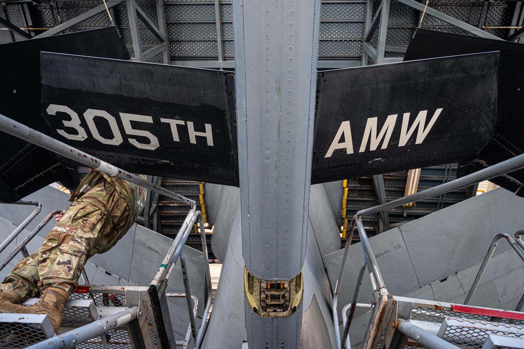 U.S. Air Force Senior Airman Austin Mooney, 305th Maintenance Squadron crew chief, removes a panel during the final KC-10 Extender inspection at Joint Base McGuire-Dix-Lakehurst, N.J., April 10, 2023.