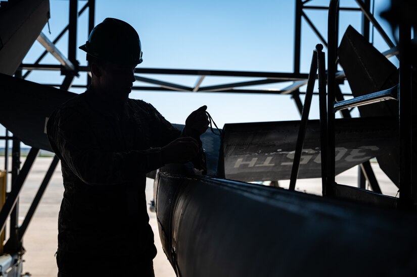 U.S. Air Force Senior Airman Jaylin Pittman, 305th Maintenance Squadron crew chief, checks tension on a boom pole during the final KC-10 Extender inspection at Joint Base McGuire-Dix-Lakehurst, N.J., April 10, 2023.