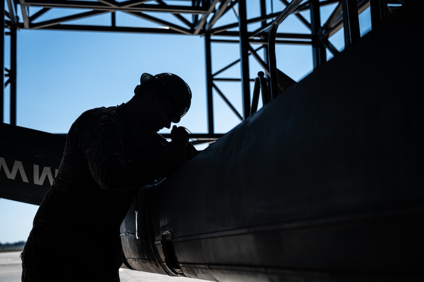 U.S. Air Force Senior Airman Jaylin Pittman, 305th Maintenance Squadron crew chief, checks tension on a boom pole during the final KC-10 Extender inspection at Joint Base McGuire-Dix-Lakehurst, N.J., April 10, 2023.