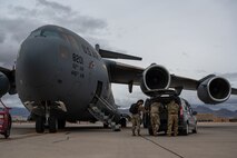 United States Air Force and Army service members disassemble the Command and Control Element after Black Flag 23-1 at Nellis Air Force Base, Nevada, Feb. 23, 2023. This allowed for Air Force Command and Control to access real time data and resources to execute live operations. (U.S. Air Force photo by Airman 1st Class Josey Blades)