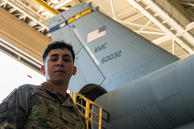 U.S. Air Force Staff Sgt. Rene Gonzalez, 305th Maintenance Squadron dock chief, poses for a photo during the final KC-10 Extender inspection at Joint Base McGuire-Dix-Lakehurst, N.J., April 10, 2023.