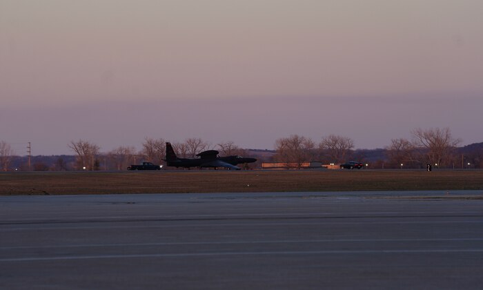 U.S. Air Force 9th Aircraft Maintenance Squadron Airmen place pogos under the wings of a U-2 Dragon Lady, April 1, 2023, at Offutt Air Force Base, Nebraska.