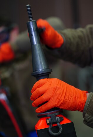 A U.S. Air Force 9th Maintenance Squadron fuels systems craftsman cleans a pogo during Dragon Flag EAST, April 3, 2023, at Offutt Air Force Base, Nebraska.