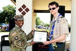 U.S. Army Command Sgt. Maj. Nicole Reddick (left), 502nd Force Support Group, presents a certificate for the President’s Volunteer Service Award to Marshall Lamont, 15-year-old, Apr. 1, 2023, at Joint Base San Antonio-Randolph, Texas. Lamont earned the award by earning over 70 hours of volunteer time. The award honors individuals whose service positively impacts communities in every corner of the nation and inspires those around them to take action, as well.