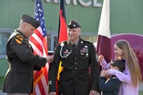The children of Sgt. Maj. Andrew Colburn affix his new rank to his jacket sleeves during a ceremony to promote the U.S. Army Medical Materiel Center-Europe’s senior enlisted adviser to the rank of sergeant major March 3, 2023, at USAMMC-E in Kaiserslautern, Germany. Also pictured is USAMMC-E Commander Col. Deon Maxwell. (Courtesy)
