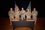 From left, Lt. Col. Brooks Hayward, Tech. Sgt. Connor Cunio, Sgt. 1st Class Joseph Wyner, Capt. Patrick Randall and Sgt. 1st Class David Musso gather with their impressive haul of awards from the 2023 U.S. Army Small Arms Championship on March 18 at Fort Benning, Georgia. NHNG's 