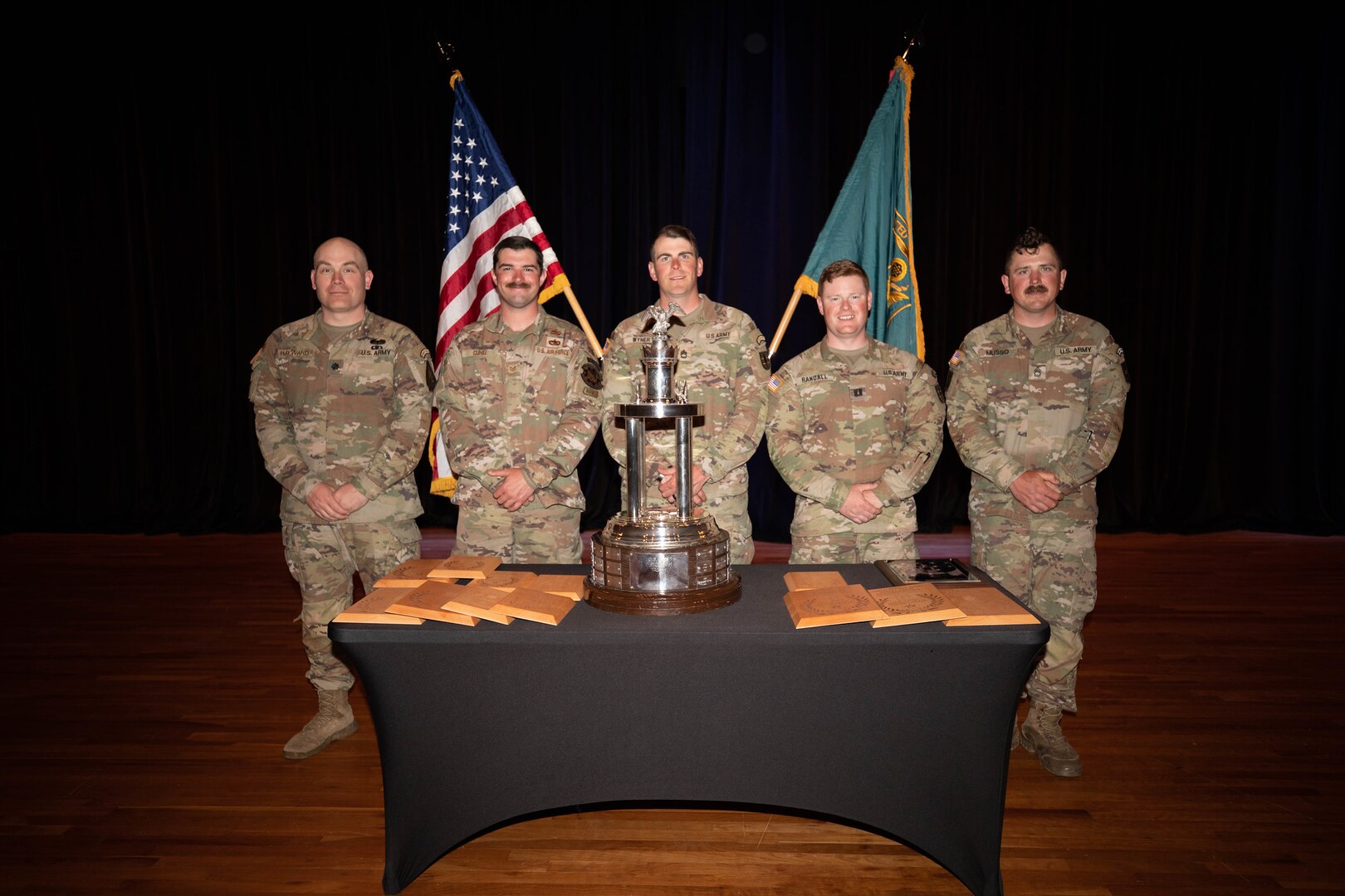 From left, Lt. Col. Brooks Hayward, Tech. Sgt. Connor Cunio, Sgt. 1st Class Joseph Wyner, Capt. Patrick Randall and Sgt. 1st Class David Musso gather with their impressive haul of awards from the 2023 U.S. Army Small Arms Championship on March 18 at Fort Benning, Georgia.