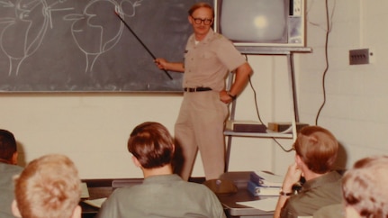 Historical image of CID agent instructing Soldiers in a classroom