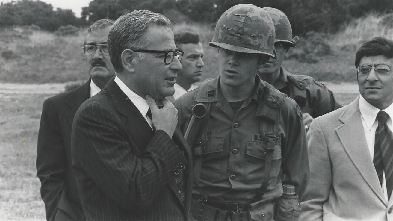 Historical photo of Protective Services and Secretary of Defense Harold