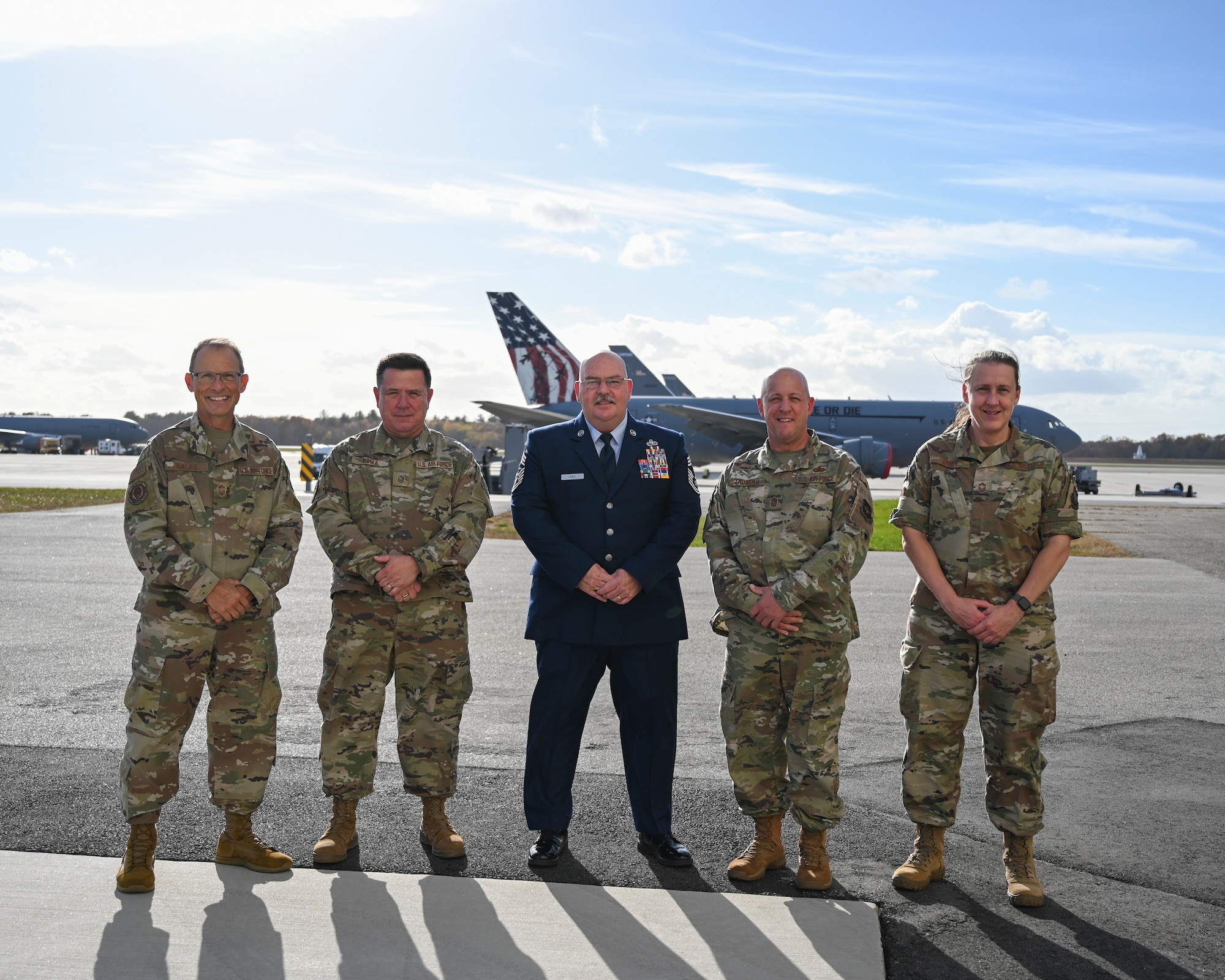 Airmen stand on the flightline