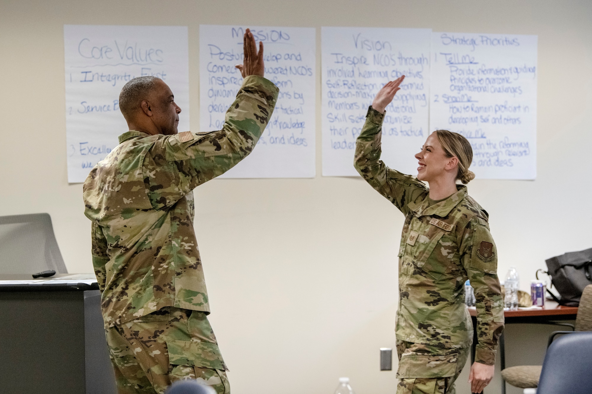 U.S. Air Force Chief Master Sgt. Timothy White, Air Force Reserve Command Chief, high-fives another student during the last day of the NCO Leadership Development Course at Robins Air Force Base, Georgia on March 31, 2023.