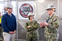 The Honorable Erik Raven, Under Secretary of the Navy, and Adm. Lisa Franchetti, Vice Chief of Naval Operations, speak to Capt. Jip Mosman, commander, Puget Sound Naval Shipyard & Intermediate Maintenance Facility, during a tour of the Machine Shop, Building 431, March 29, 2023, at PSNS & IMF in Bremerton, Washington. (U.S Navy photo by Wendy Hallmark)