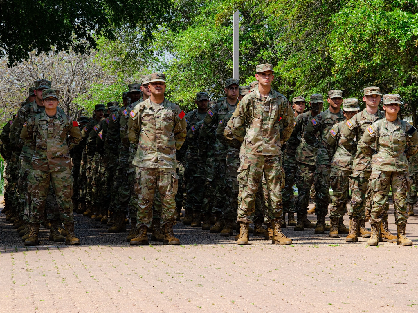 U.S. Army Element Echo Company trainees stand in formation after attending English language courses at the Defense Language Institute English Language Center at Joint Base San Antonio-Lackland, Texas, April 03, 2023. DLIELC is the largest English language training program in the Department of Defense supporting security cooperation objectives for pre-basic combat training trainees in the U.S. Army and Coast Guard, and international military partners. (U.S. Air Force photo by Agnes Koterba)