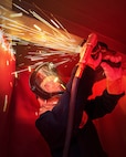 Sydney Bennett, shipfitter trainee, Shop 11, Shipfitter, works inside the newly re-dedicated School of Steel training facility April 5, 2023, at Puget Sound Naval Shipyard & Intermediate Maintenance Facility in Bremerton, Washington. (U.S. Navy photo by Wendy Hallmark)