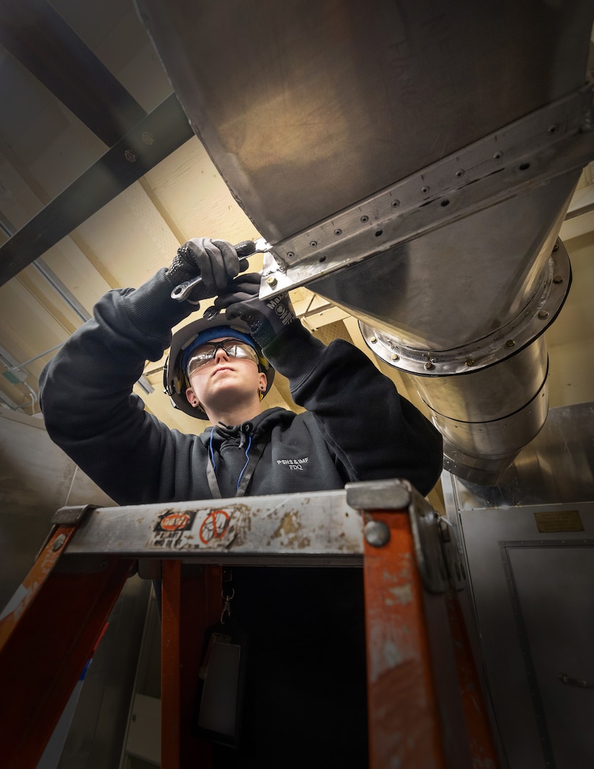 Sydney Bennett, shipfitter trainee, Shop 11, Shipfitters, works inside the newly re-dedicated School of Steel training facility April 5, 2023, at Puget Sound Naval Shipyard & Intermediate Maintenance Facility in Bremerton, Washington. (U.S. Navy photo by Wendy Hallmark)