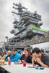 USS Ronald Reagan (CVN 76) project team members celebrate the availability's halfway point with a barbecue March 17, 2023, in Yokosuka, Japan. (U.S. Navy photo by Wendy Hallmark)