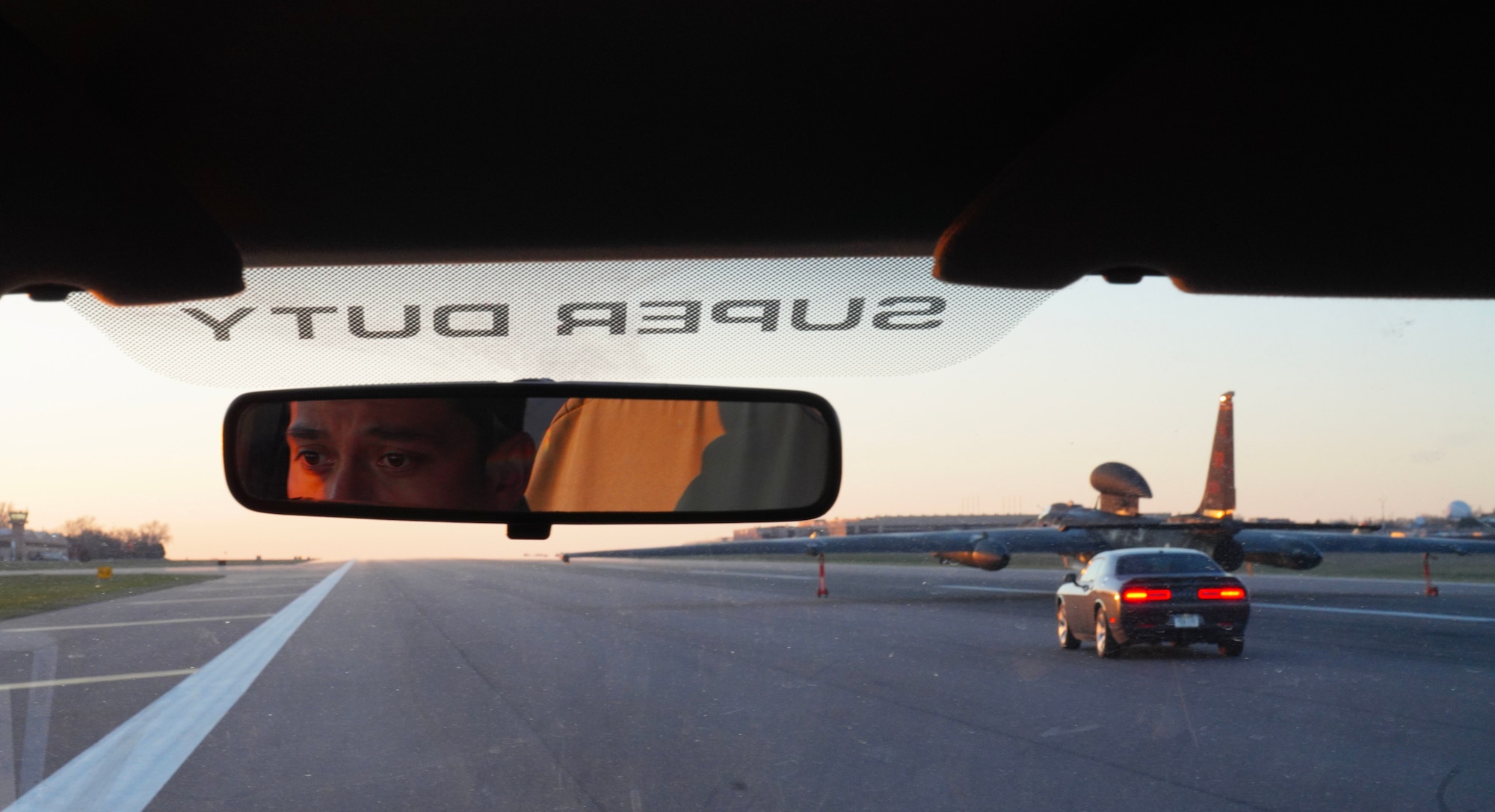 A U.S. Air Force 9th Aircraft Maintenance Squadron electrical and environmental systems craftsman drives a pogo truck following a U-2 Dragon Lady and chase car after landing during Dragon Flag EAST, April 5, 2023, at Offutt Air Force Base, Nebraska.